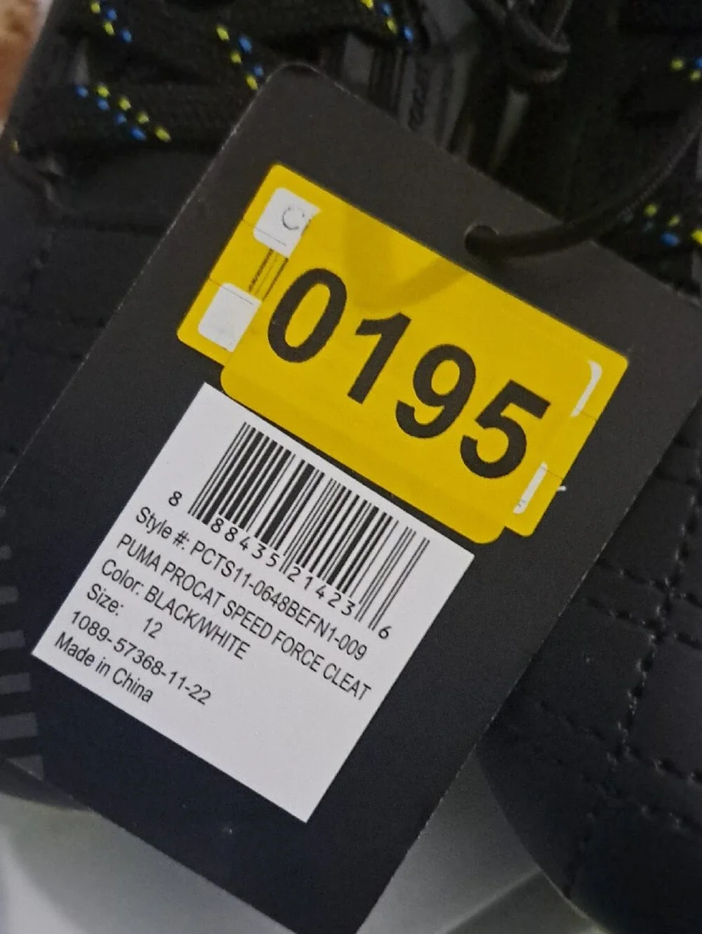 Puma Kids Black Soccer Cleats with Yellow Sole and Blue Studs